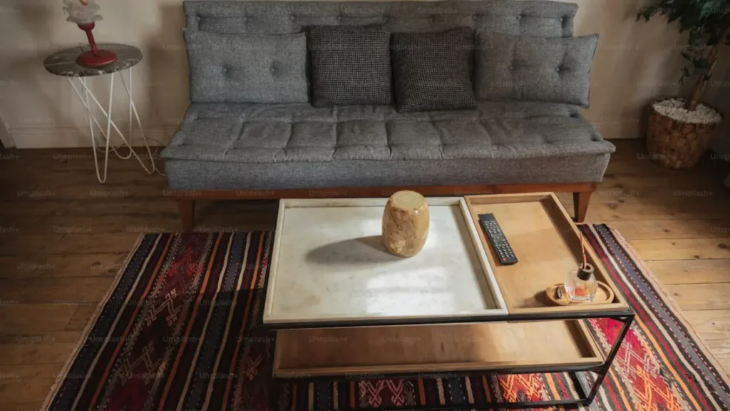 grey couch rug ideas — rust terracotta living room