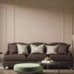 living room with a brown sofa styled with warm neutral decor